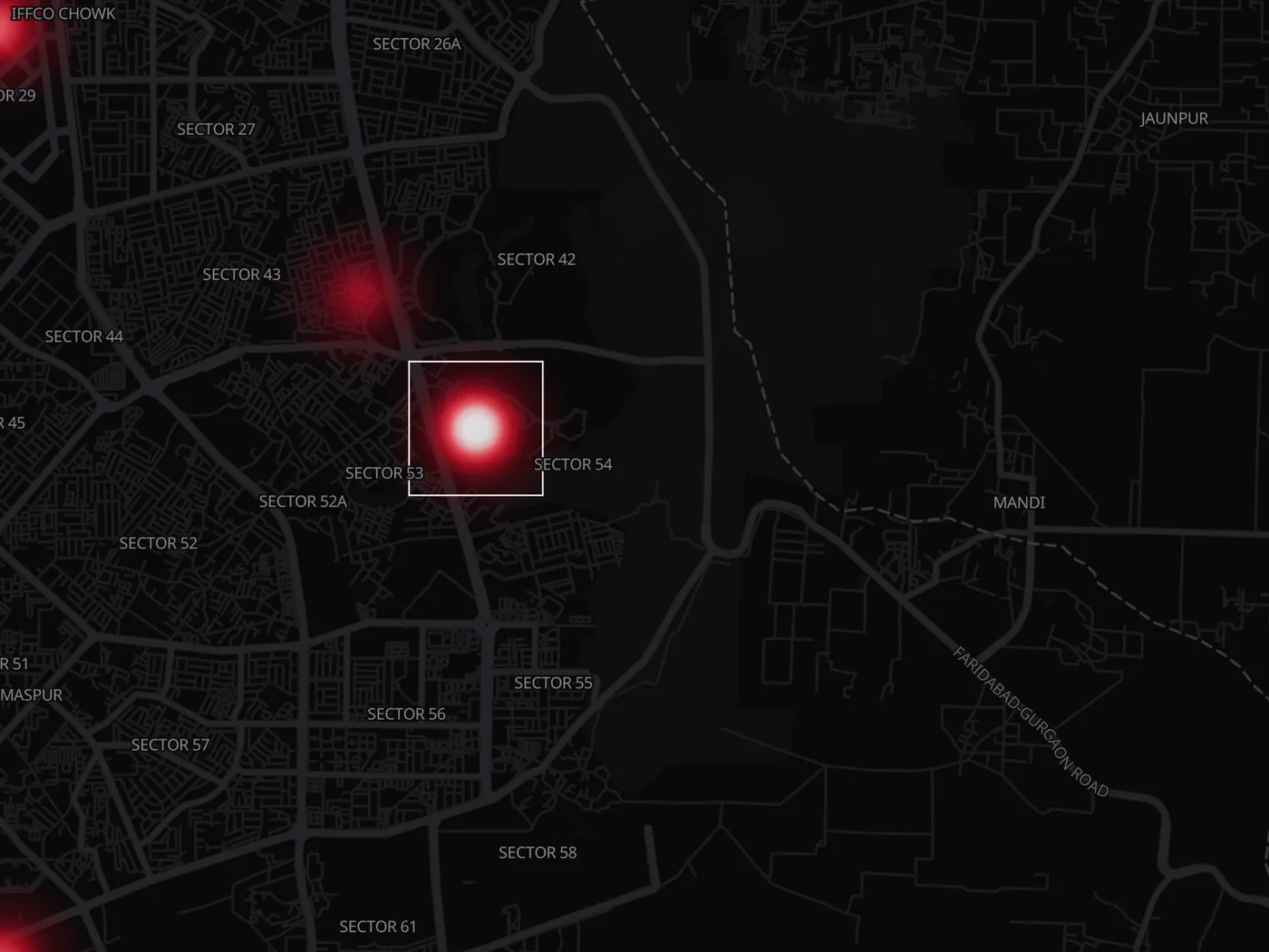 Close-up of the map over Gurugram: one ~1 km cell on Golf Course Road outlined in white, glowing white-hot